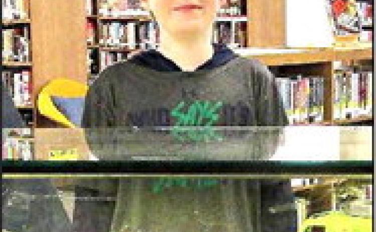 Displayer for the month of September 2023 at Rhoads Memorial Library is Liam Cosden, 11 years old who is exhibiting replicas of various types of military vehicles.