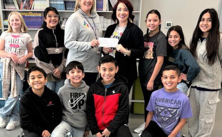 The RES Student Council raised money during their Hat Days during Christmas to donate to Snack Pak 4 Kids.