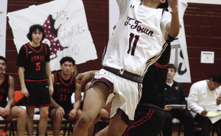 Elijah Wonzo goes in for a layup