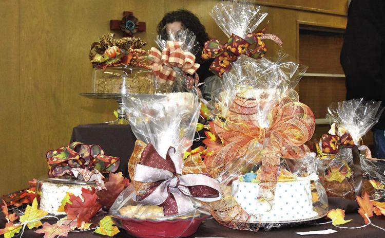 TIE 'EM DOWN--Desserts so light and delightful that they could well float away will be offered for purchase at auction at the 15th annual Samaritan Hospice Dessert Auction and Brisket Dinner Tuesday, November 25 beginning at 6 p.m. in the Lamar Room of King's Manor. (Photo by Jim Steiert)