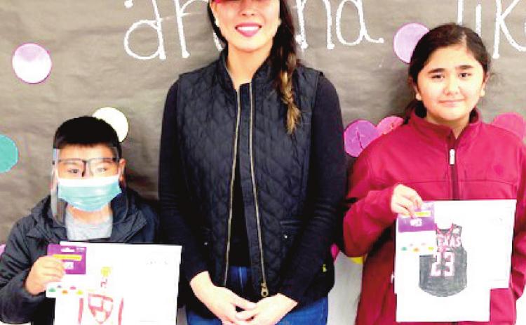 Richardson Elementary School Principal Maritssa Flores congratulated the students who won the College Week coloring contest, Kaiden Phan, 4th grade, and Liliana Rivera, 5th grade.