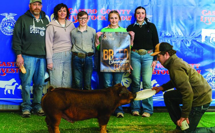 Addie Birkenfeld is pictured with her Breed Champion Duroc.