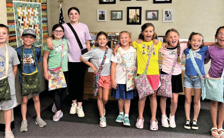 Castro County 4-Hers recently attended a sewing workshop where they made messenger bags. The 10 youth selected fabrics, did the sewing and topstitch and added straps. Parents assisting Extension Agent Felice Acker wereKarenWanjura, Madelyn Kern, Cindy Gerber and extension secretary Missy Kleman.