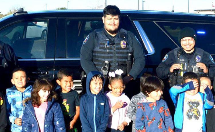 The Dimmitt Police Department took time out of their busy schedules to spend time with the students at Doricell Davis First Steps on Tuesday. Officers visited with children from most of the classes and gave them an up-close view of patrol cars.