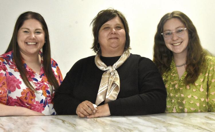 RUNNING NEW FSA OFFICE--These lovely ladies make the new Farm Service Administration office at 1500 West Park Avenue run. At center is Lori Johnson, who grew up a Hereford girl, although she lives at Nazareth now. She is the FSA County Executive Director. To Mrs. Johnson's left and right are Program Analysts Bailey Urbanczyk and Tay Criswell. (Photo by Jim Steiert)