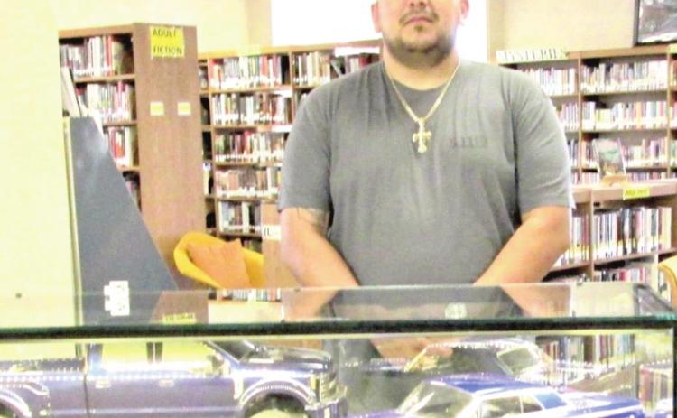 January Display of the Month is Sam Cavazos with remote control 1964 Chevy Impalas and F450 pickups.