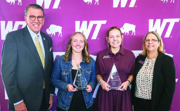 West Texas A&amp;M University President Walter V. Wendler, left, and Pamp Young, right, assistant vice president for human resources, celebrate the WT student employees of the year: Landry Posey, second from left, undergraduate student employee of the year, and Jessica Kenedy, second from right, graduate assistant of the year.