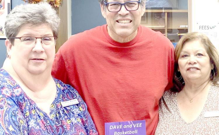 David Espinoza with Library personnel Gaye Reily and Sulema Oltivero.