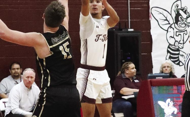 Logan Becerra shoots for three
