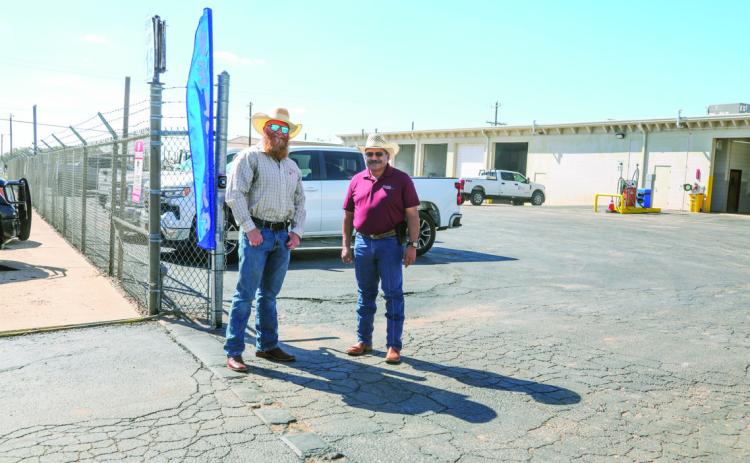 Welcome committee at the Swisher Electric Annual Cooperative Month Hamburger cook-out, Corey Morton and Henry Cruz
