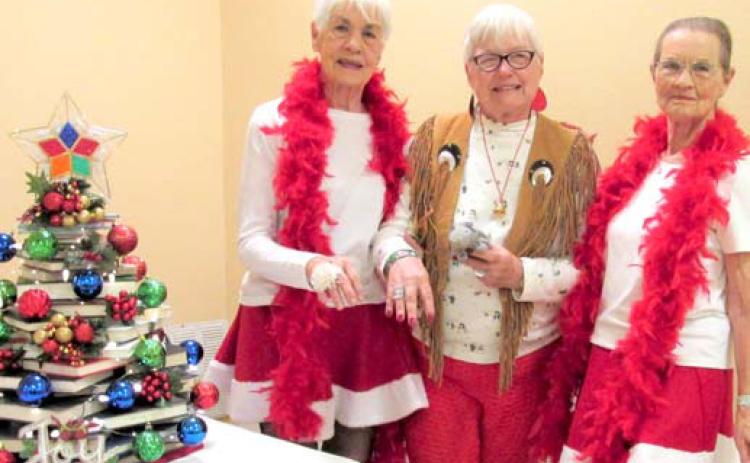 (left to right) Laurel (Ivey) Austin of Abernathy, Mary Ruth Baird, and Zetha Collins provided the Christmas program for Dimmitt Book Club in the meeting room of Rhoads Memorial Library.