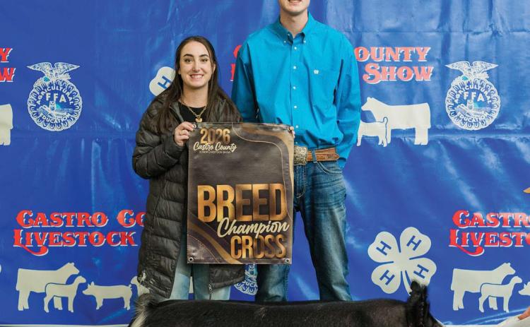 Zac Huseman is pictured with his Breed Champion Cross.