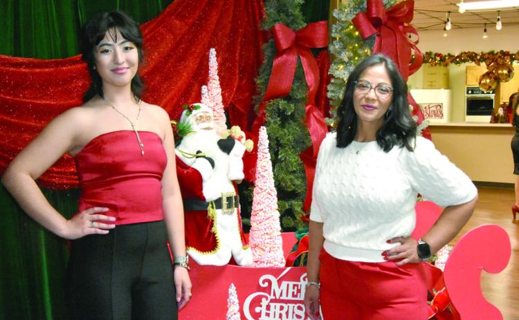 READY TO SLEIGH—Anahi Gonzales and Vanessa Nava, executive director of the Hereford Senior Citizens Association, hope for a ride with Santa at the Festival of Trees. (Photos by Jim Steiert)