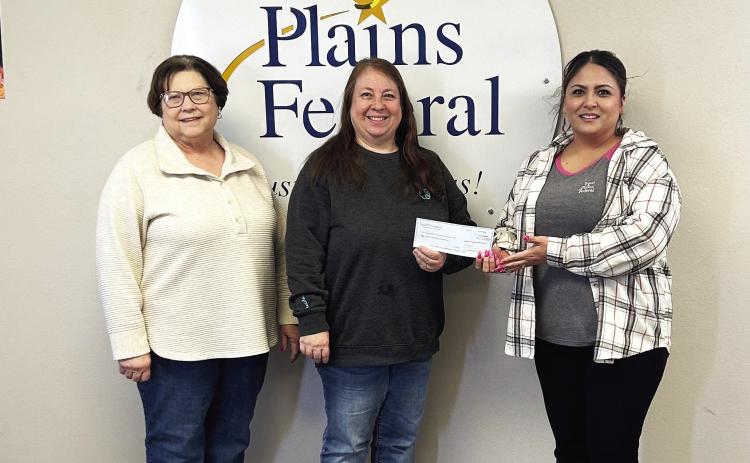 Becky Tucker and Debbie Bales receiving donation from April Garza, Branch Manager Texas Plains FCU, Tulia, Texas