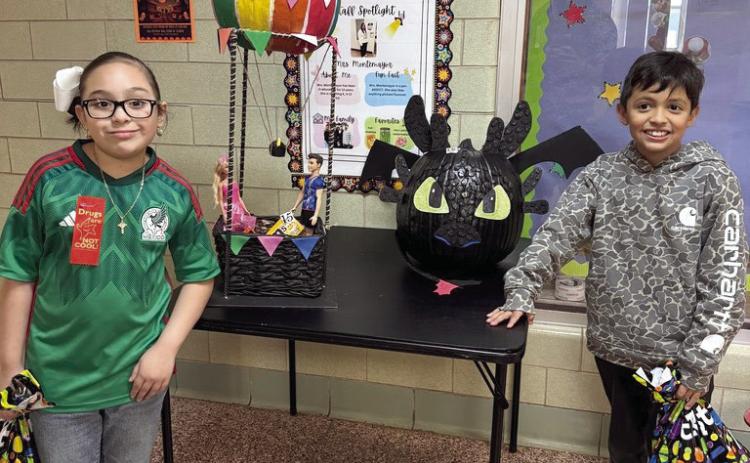 Winners of the Pumpkin Coloring Contest for Hart ISD included Kamila Jimenez with her Hot Air Balloon and Santiago Medrano with Toothless.