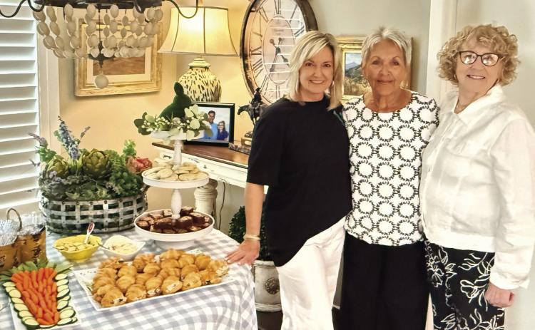 La Madre Mia held their March 26 meeting at Sandy Josserand’s home. Pictured (left to right) are Sandy Josserand and co-hostesses Judy Williams and Carolyn Baxter. (Photo By Angela Blackmon)