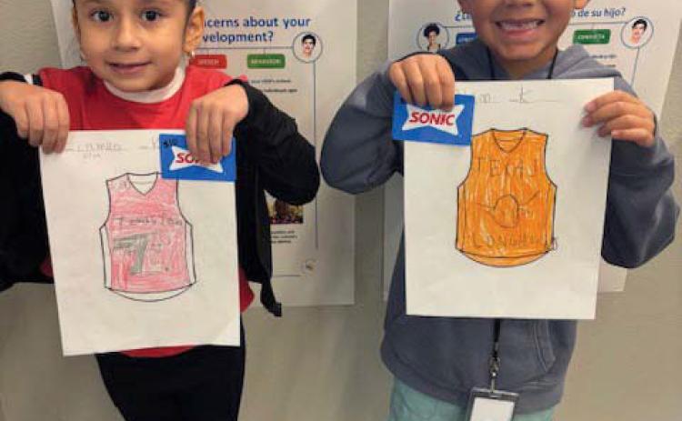 Camilla Silva and Harlem Aleman (K-2nd top boy and girl winners)