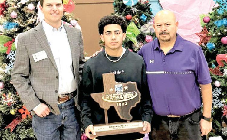 Last Thursday, Jon Garland from Whiteface Ford in Hereford presented DHS football player Tony Salazar with the Built Ford Tough Player of the Week Award. The award was based on the game against the Highland Park Hornets where Salazar came in with 396 yards on 23 attempts and seven touchdowns. DHS head coach Johnny Nino joined Salazar at the presentation. Salazar was also named All-District 1st Team Running Back this season.