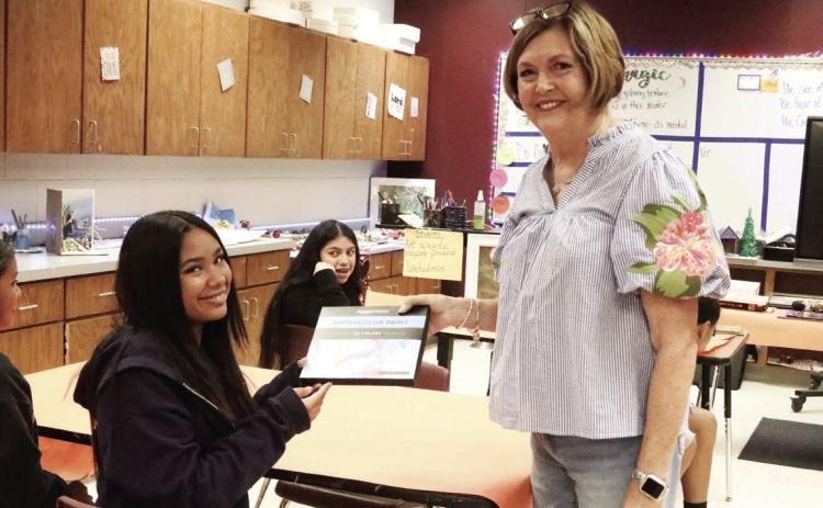 Kimora Powell won a watercolor set in a drawing from Mrs. Herring