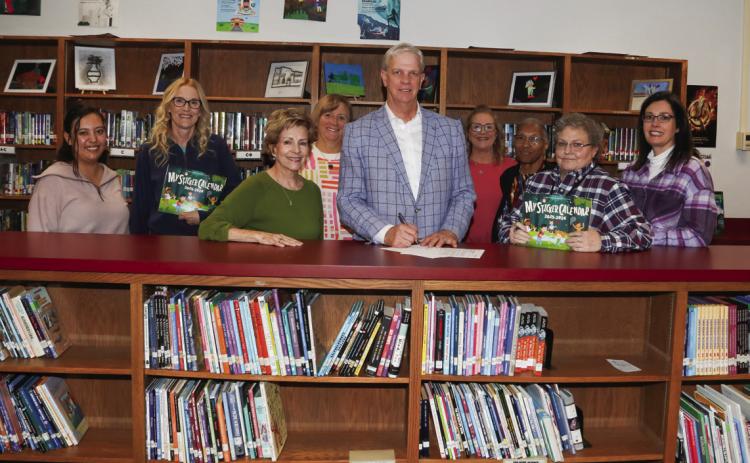 Judge Clawson recognized April as Child Abuse Prevention Month in Swisher County. Pictured are Lillian Araiza, Sharon Wyatt, Joyce Childers, Nancy House, Judge Michael Clawson, Lisa Hooper, Yvonne Fifer, Lynnett Walker, and Dr. Tori Marnell.